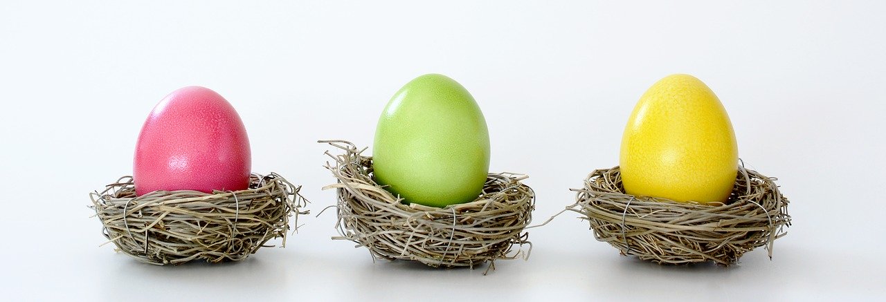 Easter eggs, pink, green and yellow respectively, from left to right