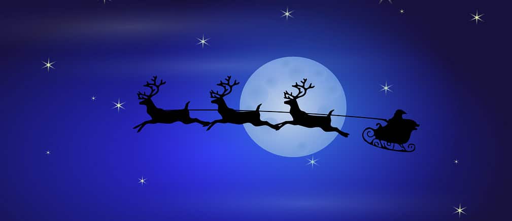 Père Noël qui passe devant la lune avec son traineau, fond bleu, étoiles